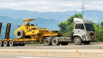 Lowboy trailer for heavy hauling image.