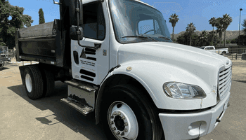 An image of Ford dump truck from boom and bucket.