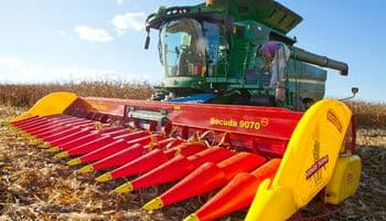 Heavy Equipment Operator Working on Large Farm Equipment