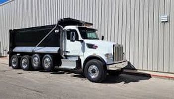 Close-up of a Peterbilt truck parked outside a warehouse